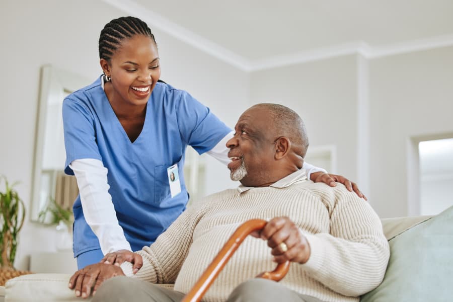 Companion caregiver visiting with a senior at home in Maitland, Central Florida