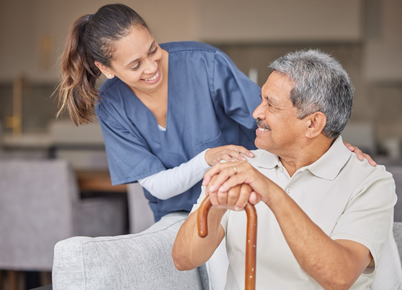 CNA helping a senior client with personal care at home in Maitland, Central Florida